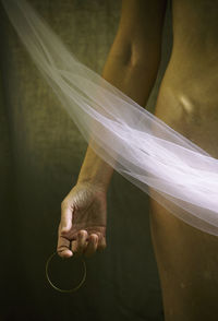 Woman covering herself with tulle in the style of paintings from the baroque era