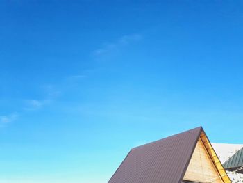 Low angle view of building against blue sky