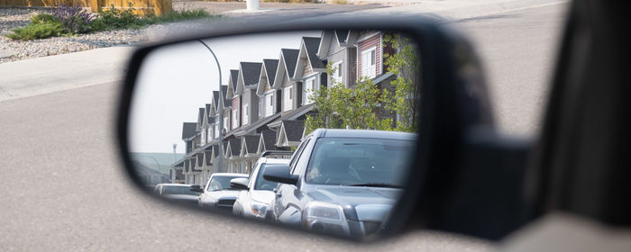 Reflection of car on side-view mirror