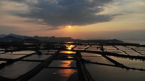 Scenic view of sunset over city