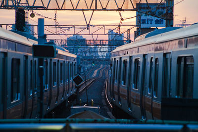 Railroad tracks with buildings in background