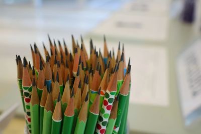 Close-up of multi colored pencils on table