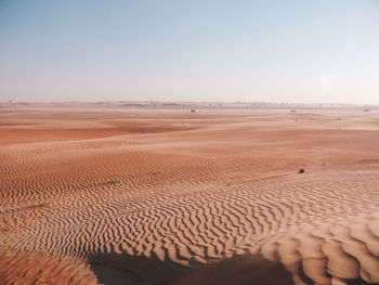 Scenic view of desert against clear sky