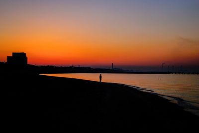 Scenic view of sea against clear sky during sunset