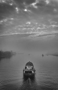 Boat in sea against sky