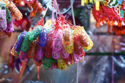 Close-up of colorful balloons hanging on tree