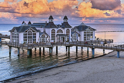 View of pier on sea during sunset