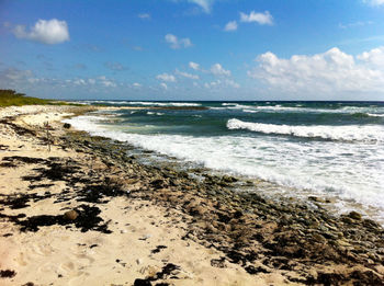 Scenic view of beach against sky