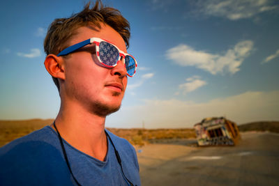 Portrait of young man wearing sunglasses