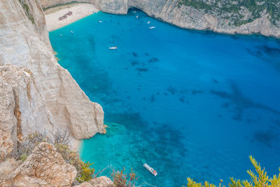 High angle view of rocks on sea shore