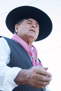 Portrait of man wearing hat looking away