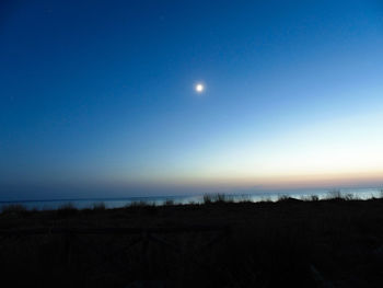 Scenic view of landscape against sky at night