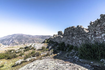 Scenic view of rocky mountains against clear sky