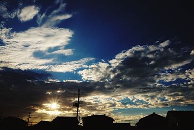 Low angle view of silhouette building against sky