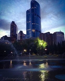 Buildings against sky at dusk