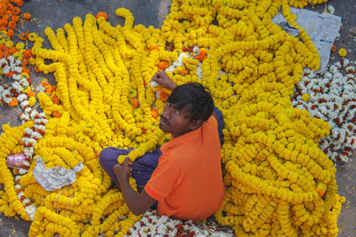     holding yellow flowers