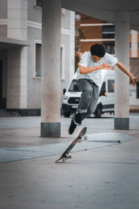Full length of man skateboarding on skateboard
