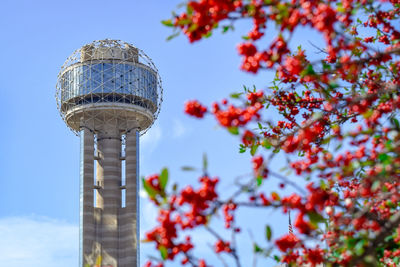 Low angle view of communications tower against sky