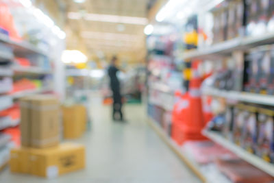 Blurred motion of man at store