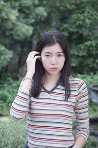 Portrait of teenage girl standing outdoors