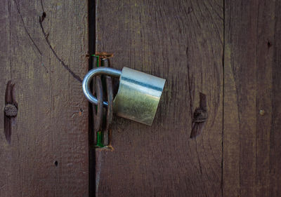 Close-up of padlocks hanging on door