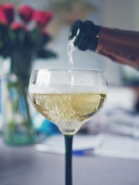 Close-up of wine poured into wineglass