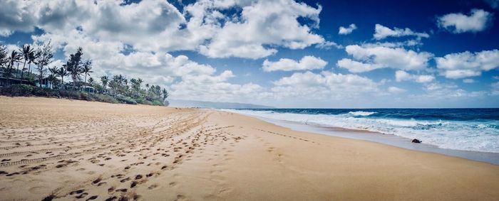 Scenic view of beach against sky