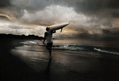 Side view of man standing on beach