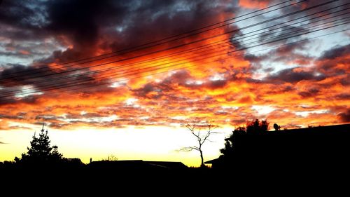 Low angle view of cloudy sky at sunset