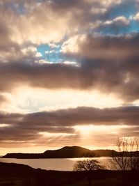 Scenic view of silhouette mountains against sky during sunset