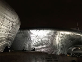 Interior of illuminated building at night