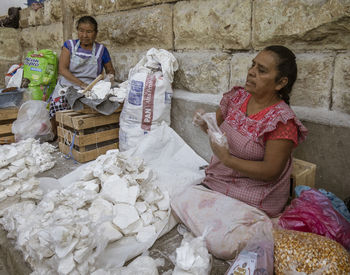 High angle view of people sitting at market