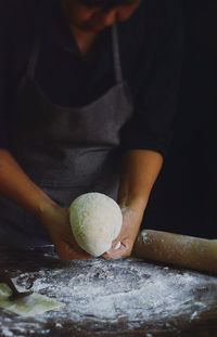 Midsection of woman preparing food