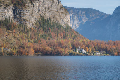 Scenic view of lake by mountains during autumn
