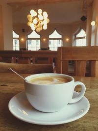 Close-up of coffee cup on table