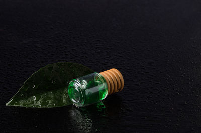 High angle view of bottle on glass