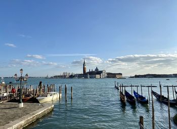 Boats in sea against sky