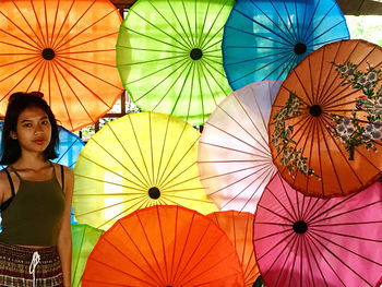 Low angle view of man holding umbrella