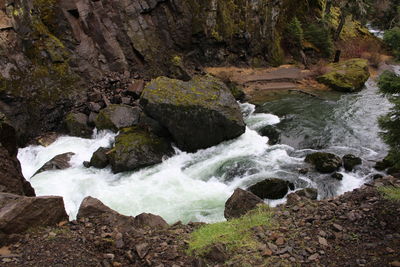 Stream flowing through rocks in sea
