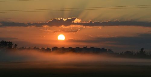Scenic view of sunset over landscape