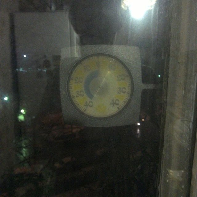 clock, communication, time, text, circle, indoors, transportation, reflection, glass - material, car, illuminated, number, close-up, mode of transport, no people, built structure, fish-eye lens, western script, transparent, land vehicle