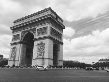 View of eiffel tower against cloudy sky