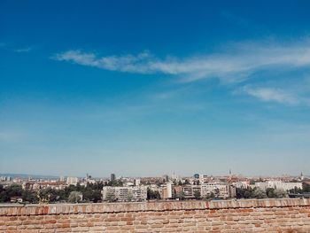 View of buildings against blue sky