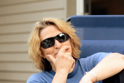 Close-up portrait of young woman wearing sunglasses