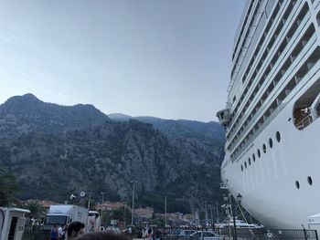 Aerial view of buildings in city against clear sky