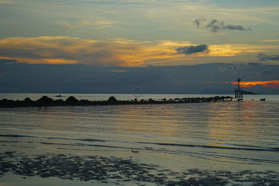 Scenic view of sea at sunset