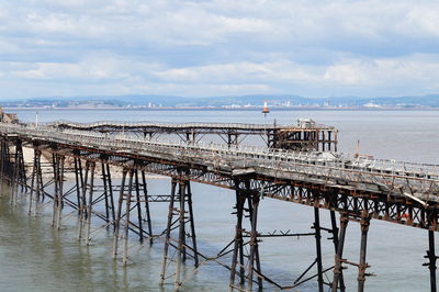 Pier over sea against sky