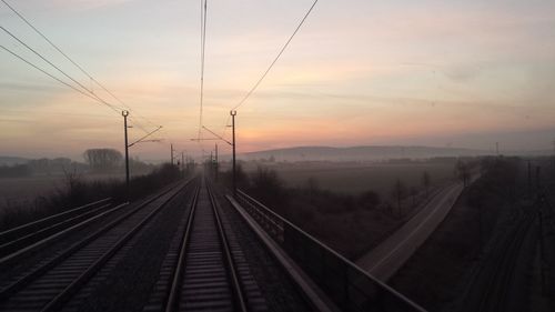 High angle view of railroad track against sky during sunset