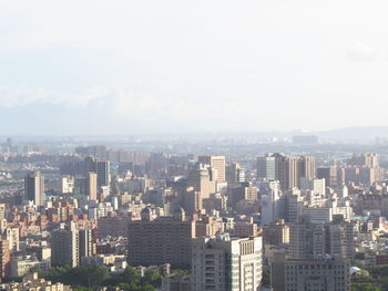 High angle view of buildings in city against sky