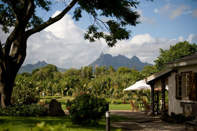 Scenic view of mountains against cloudy sky